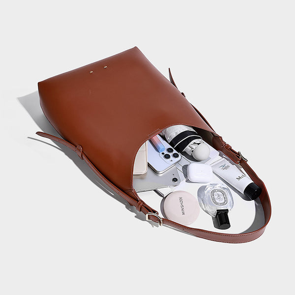 Large open-top hobo shoulder bag in tan leather-look finish with detachable zip pouch and adjustable buckle strap, detail