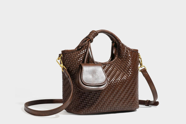 Woven leather-look tote bag in mocha brown with knotted top handle, front flap pocket, and detachable crossbody strap with