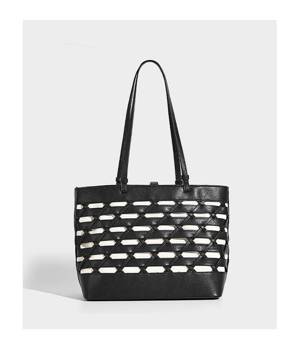 Structured woven lattice cutout tote bag with smooth leather-look trim, dual shoulder straps, and silver-tone hardware