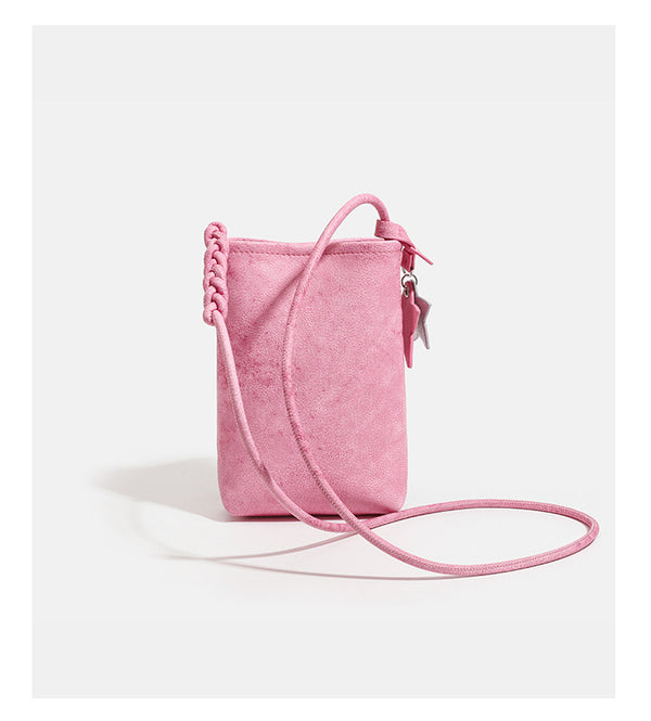 Small vertical textured mini crossbody phone bag with long braided cord strap and silver-toned star charm, detail view 13
