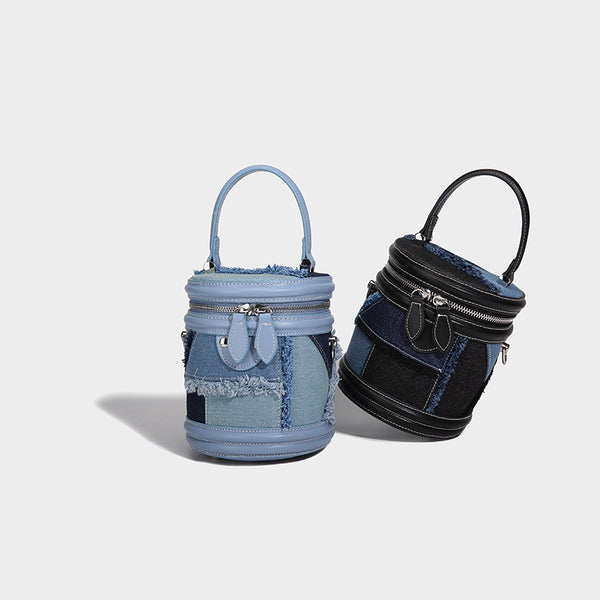 Mini cylindrical barrel bucket bag in denim patchwork with frayed edges, smooth leather-look trim, zip-around top closure