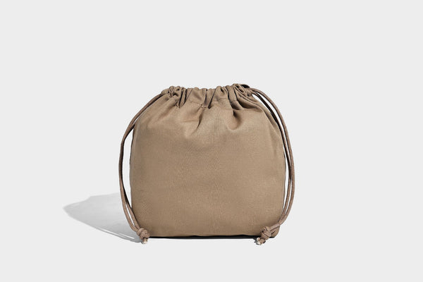 Quilted diamond-pattern tote bag with attached front zip pouch and long shoulder straps, detail view 29
