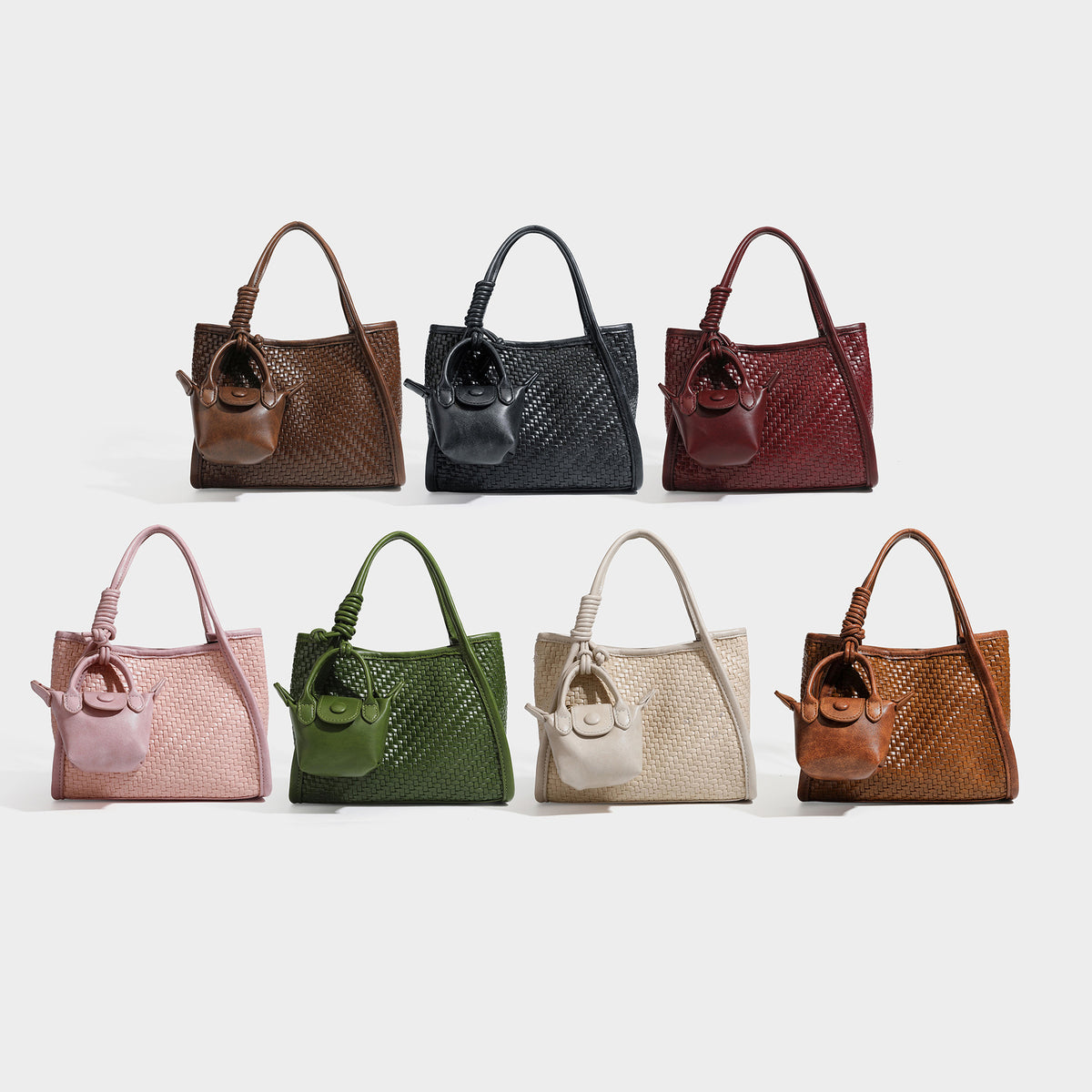 Strukturierte Tote Bag mit Webstruktur in Braun, glatten Besätzen in Lederoptik, geknoteten Tragegriffen und befestigtem Mini-Beutel mit Kordelzug