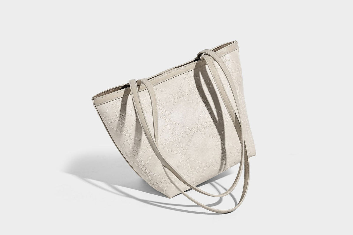 Quilted diamond-pattern tote bag with attached front zip pouch and long shoulder straps, detail view 27