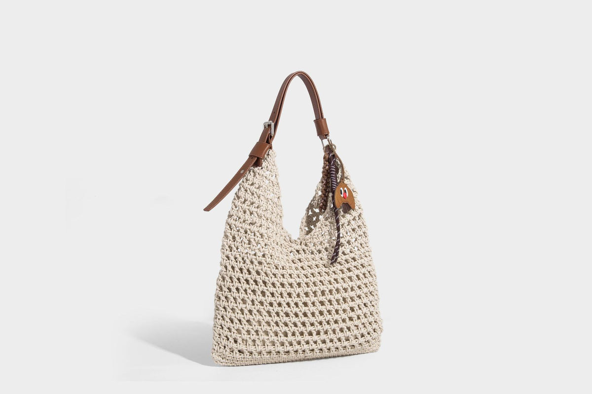 Slouchy open-knit crochet hobo tote bag with leather-look top handle and metal buckle hardware, detail view 15