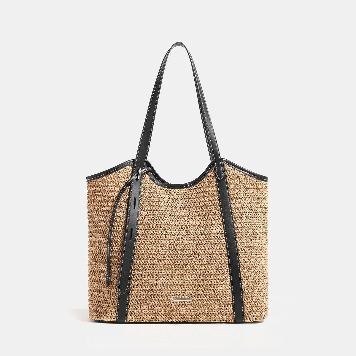 Tan woven raffia-look tote bag with black leather-look trim, long shoulder straps, and magnetic snap closure, front view