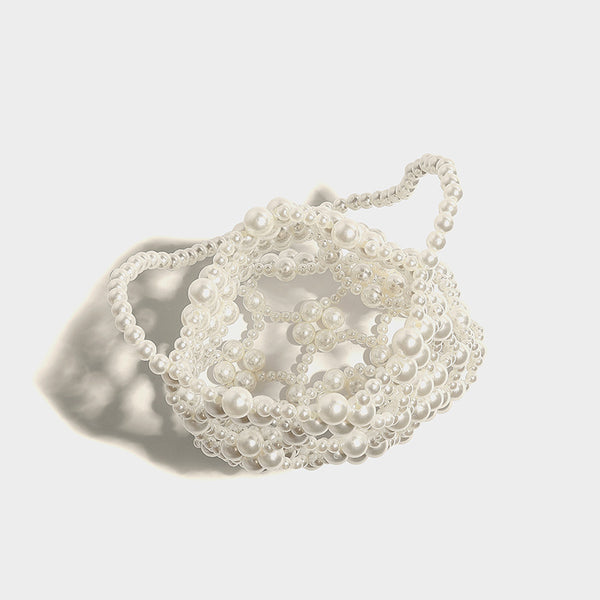 Small pearl-beaded lattice drawstring bucket bag with beaded shoulder strap and ribbon closure, detail view 23