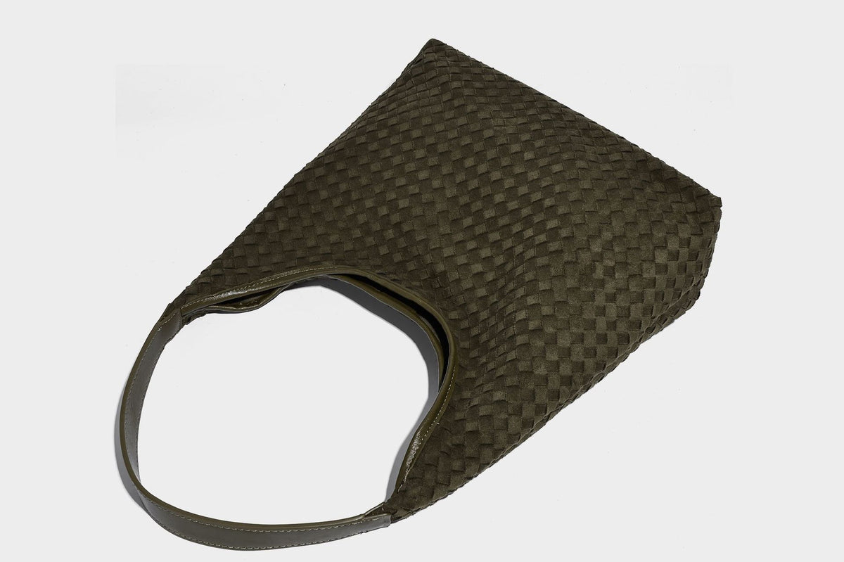 Large slouchy woven hobo tote bag with curved shoulder strap and triangular silhouette, detail view 28