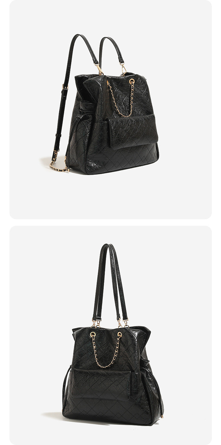 Large quilted leather-look drawstring backpack handbag with gold-tone chain handles and front flap pocket, detail view 8