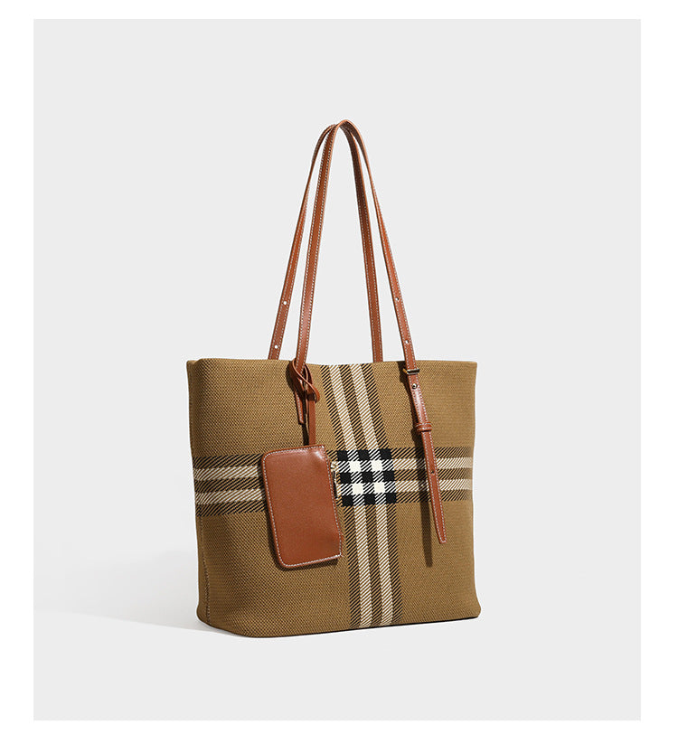 Large structured plaid check tote bag with smooth tan leather-look shoulder straps, attached front zip pouch, and gold-tone