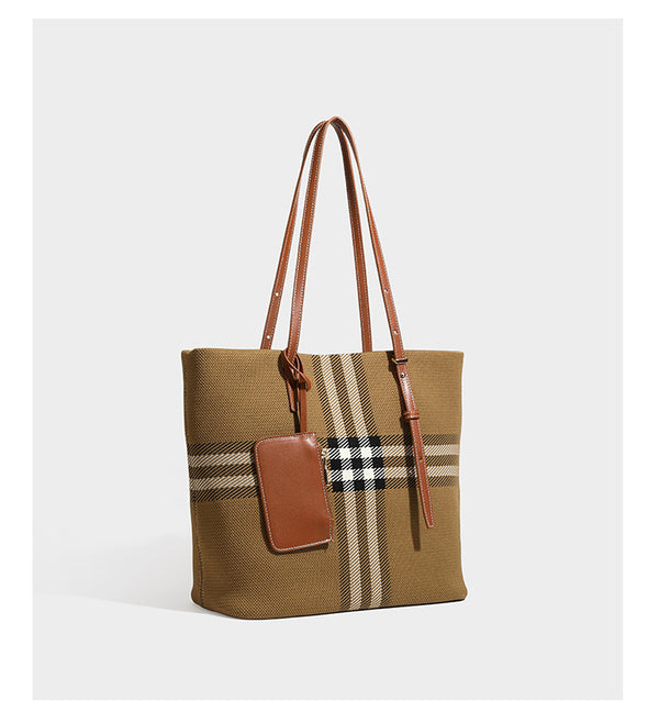 Large structured plaid check tote bag with smooth tan leather-look shoulder straps, attached front zip pouch, and gold-tone