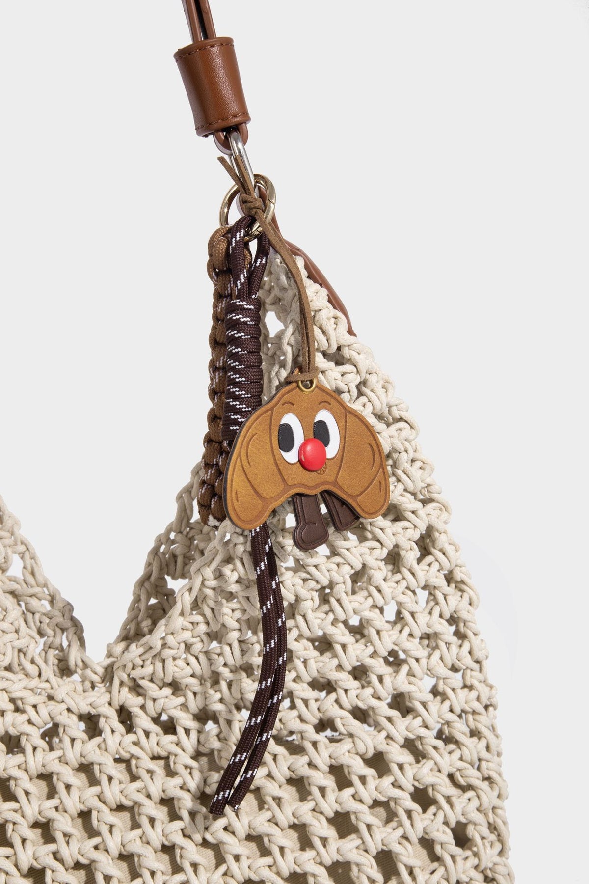 Slouchy open-knit crochet hobo tote bag with leather-look top handle and metal buckle hardware, detail view 14