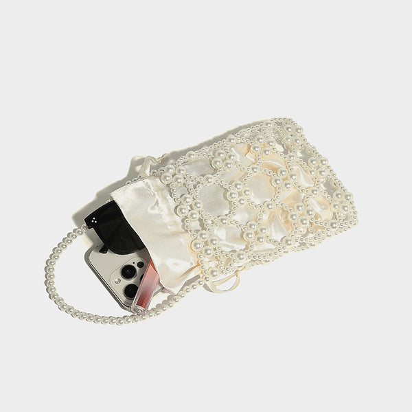 Small pearl-beaded lattice drawstring bucket bag with beaded shoulder strap and ribbon closure, detail view 4