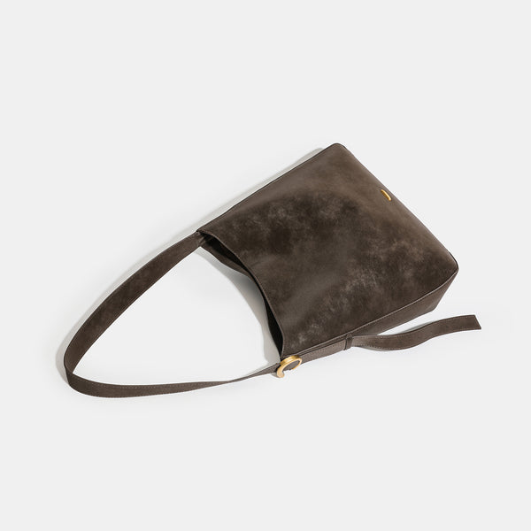 Large slouchy hobo tote bag in distressed dark brown leather-look finish with long shoulder strap, gold-tone ring hardware