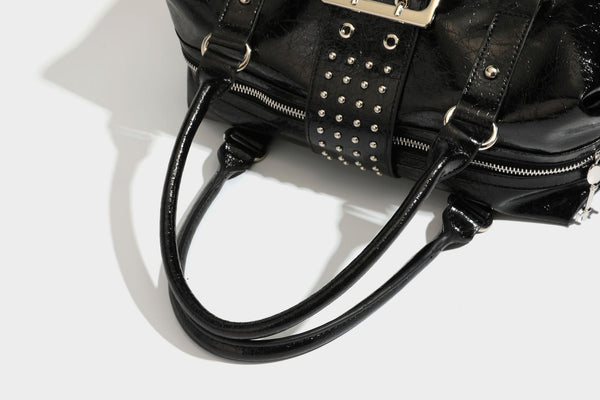 Glossy crinkled barrel handbag with silver stud buckle strap and detachable shoulder strap, detail view 34
