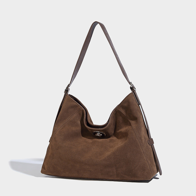Slouchy hobo shoulder bag with turn-lock flap closure and adjustable strap, detail view 18