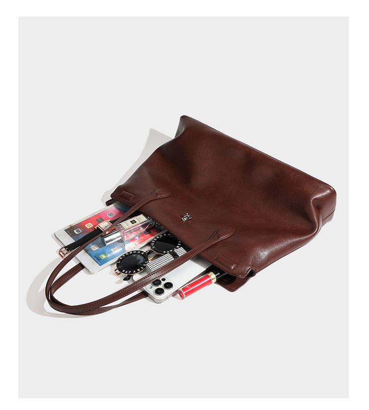 Large leather-look tote shoulder bag with slim double straps and silver-tone turn-lock closure, detail view 13
