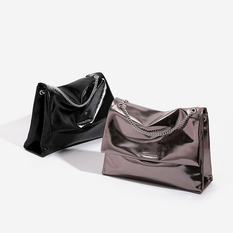Large structured glossy leather-look flap shoulder bag with silver-tone chain strap, front view