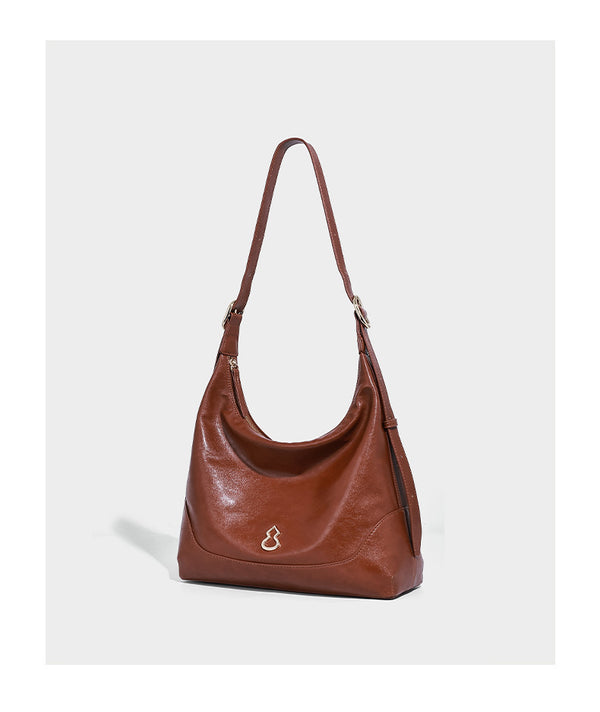 Glossy leather-look slouchy hobo shoulder bag with zip closure, gold-tone hardware, and adjustable strap, detail view 7