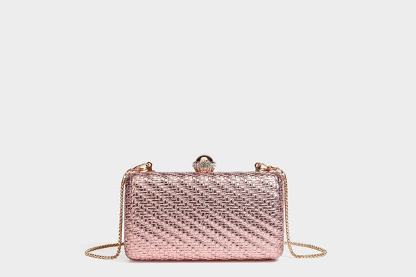 Small structured metallic woven-texture box clutch bag with jeweled kiss-lock dome clasp and slim gold chain strap, detail