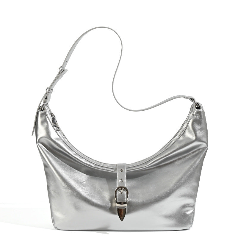 Slouchy crescent hobo bag with glossy leather-look finish, silver-tone buckle hardware, and flat shoulder strap, detail view
