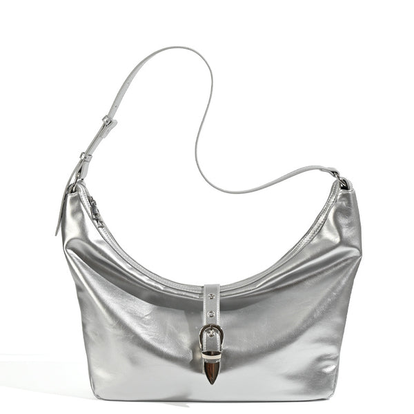 Slouchy crescent hobo bag with glossy leather-look finish, silver-tone buckle hardware, and flat shoulder strap, detail view