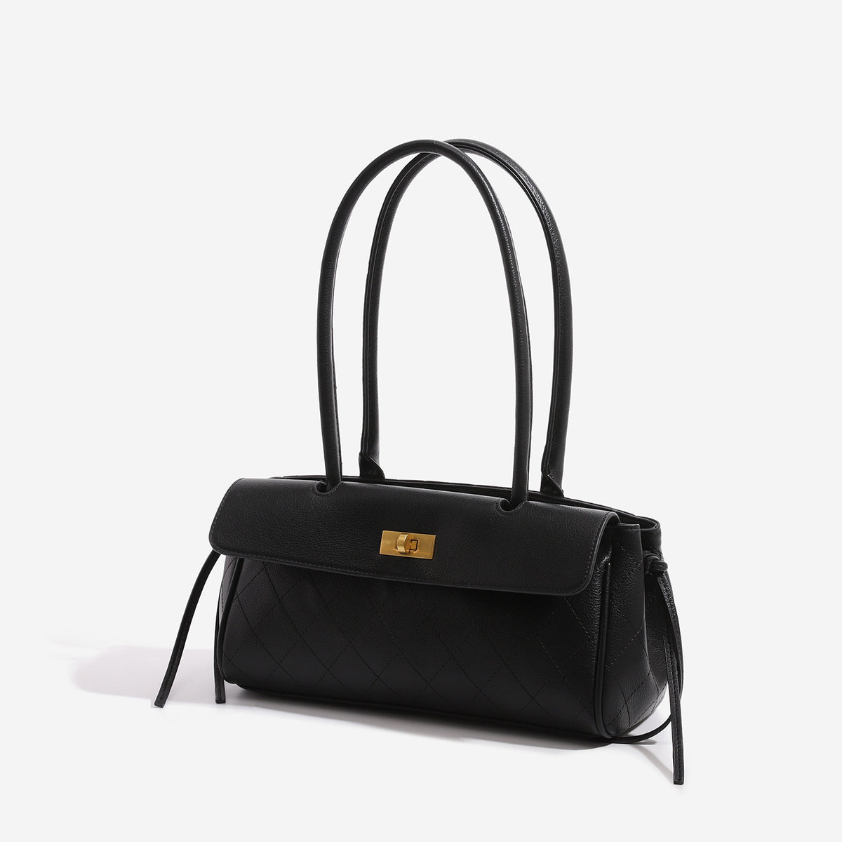 Structured quilted diamond top-handle underarm shoulder bag with gold-tone turn-lock flap closure and side tie straps, detail