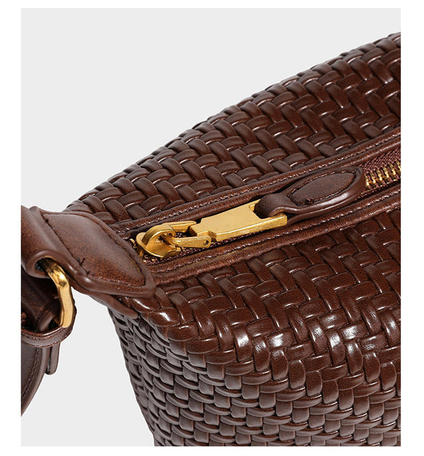 Small glossy basket-weave hobo shoulder bag in brown with knotted top handle, flap accent pocket, and gold-tone hardware
