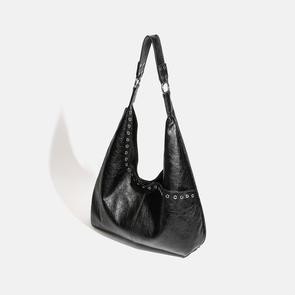 Large slouchy hobo shoulder bag with silver eyelet trim and glossy leather-look finish, detail view 3