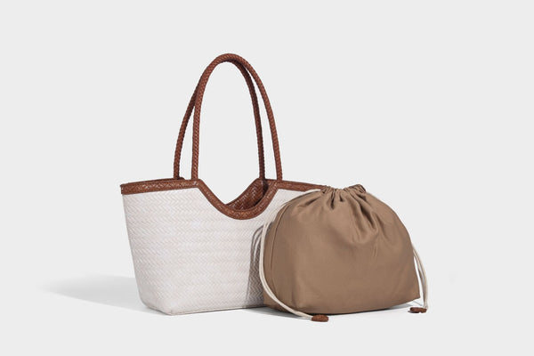 Large open-top woven tote bag with contrasting braided double handles and matching drawstring pouch, detail view 23