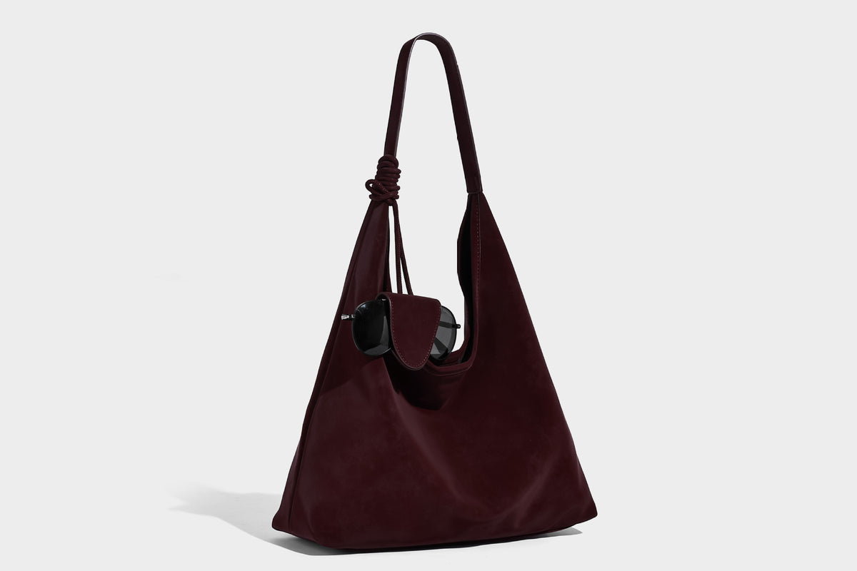 Slouchy oversized matte suede-look shoulder tote bag with knotted strap and attached front flap pouch, detail view 11