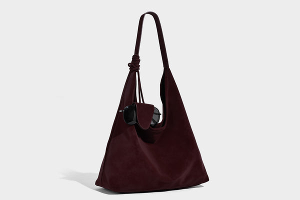 Slouchy oversized matte suede-look shoulder tote bag with knotted strap and attached front flap pouch, detail view 11