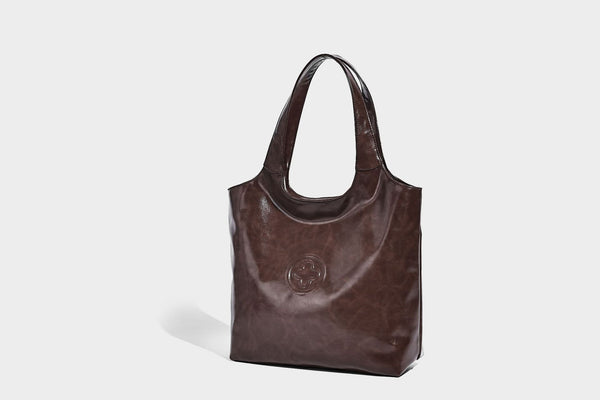 Glossy oil-wax leather-look open-top tote shoulder bag with embossed circular logo and long double straps, detail view 22