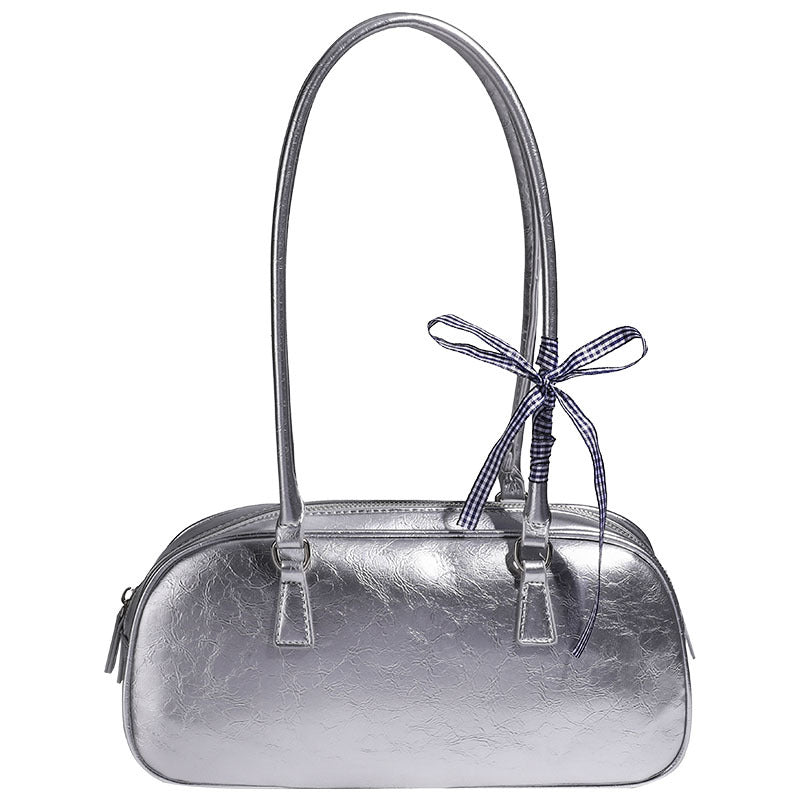 Rounded rectangular shoulder bag with glossy crinkled finish, dual long handles, top zip closure, and gingham ribbon bow