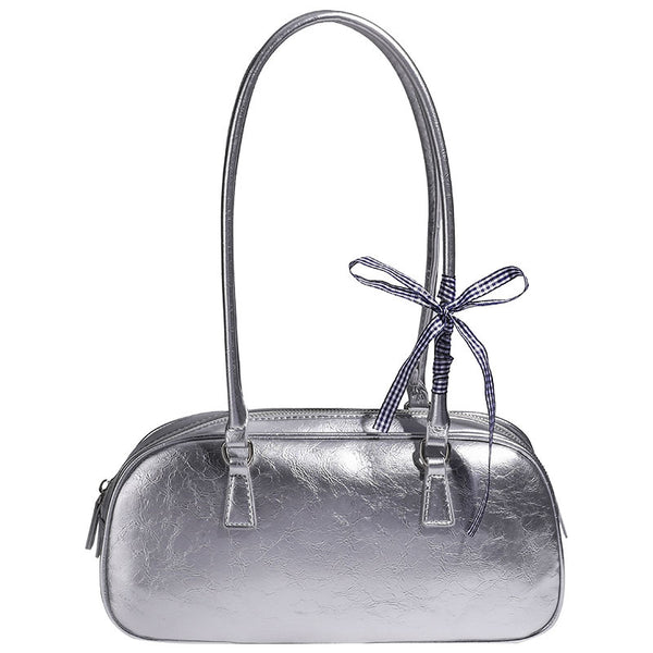 Rounded rectangular shoulder bag with glossy crinkled finish, dual long handles, top zip closure, and gingham ribbon bow