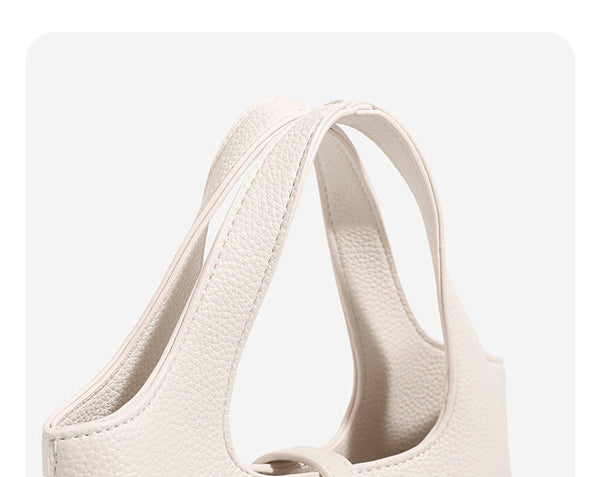 Mini pebbled leather-look bucket tote with silver toggle clasp and dual top handles, detail view 9