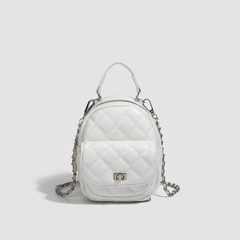 Quilted leather-look backpack purse with chain strap and turn-lock front pocket, detail view 8