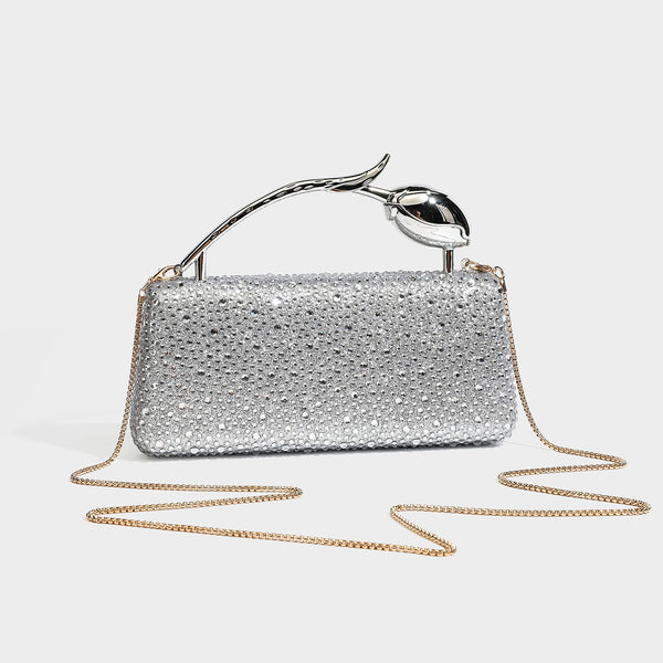 rectangular hard-case rhinestone evening clutch with sculptural gold-tone branch-and-bud top handle and detachable chain