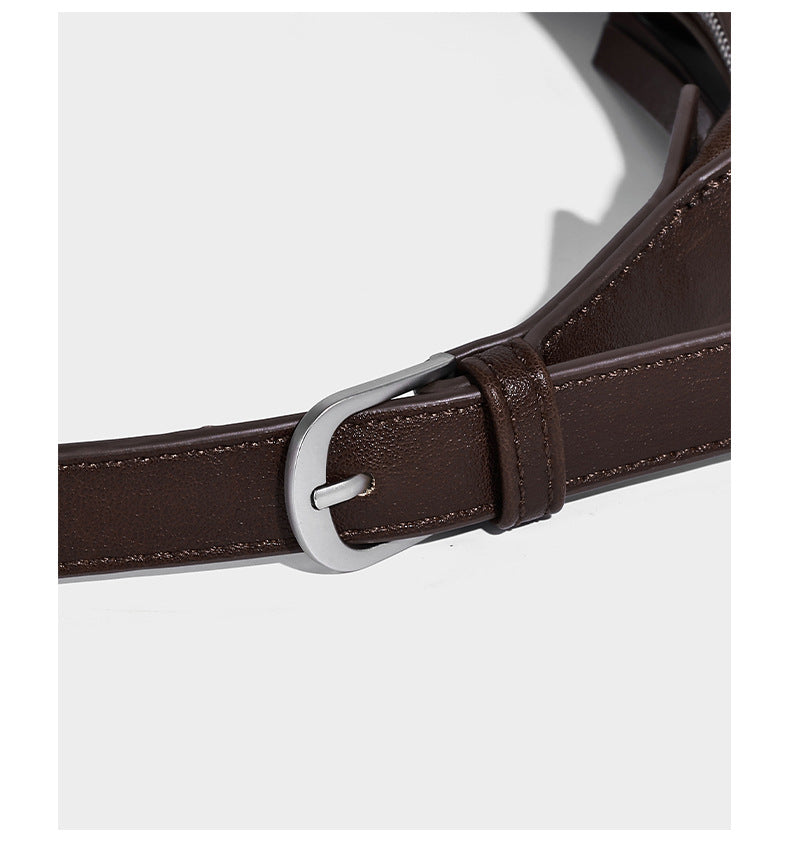 Slouchy bucket hobo shoulder bag in dark brown with glossy leather-look finish, top zip closure, and long adjustable, detail