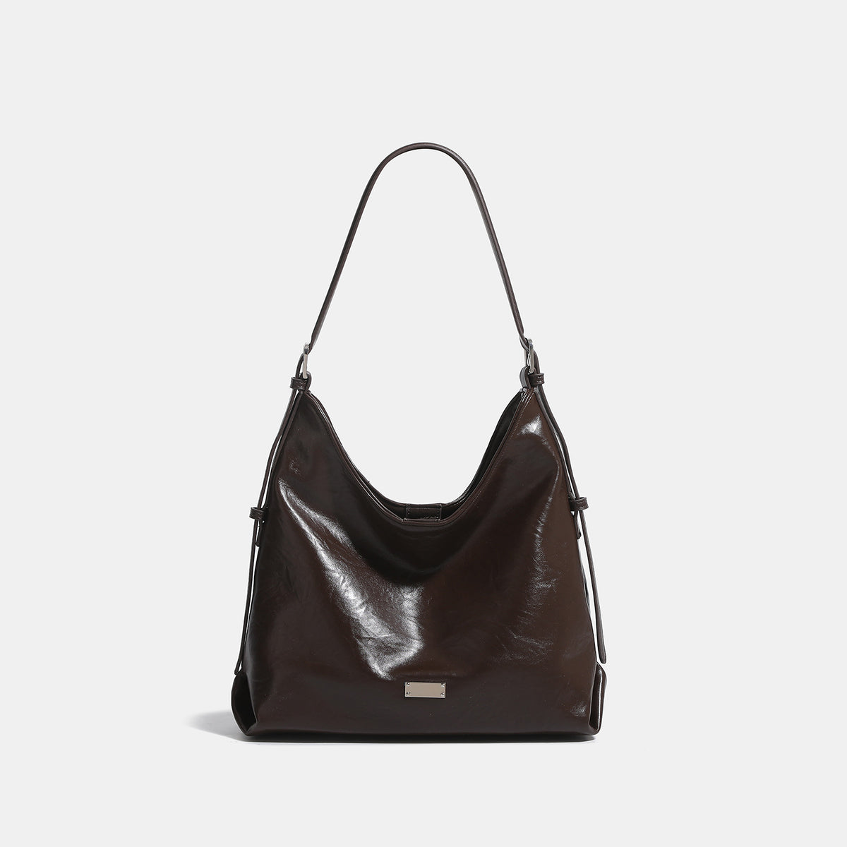 Slouchy hobo shoulder bag with glossy wrinkled leather-look finish, adjustable strap, and snap closure, detail view 9