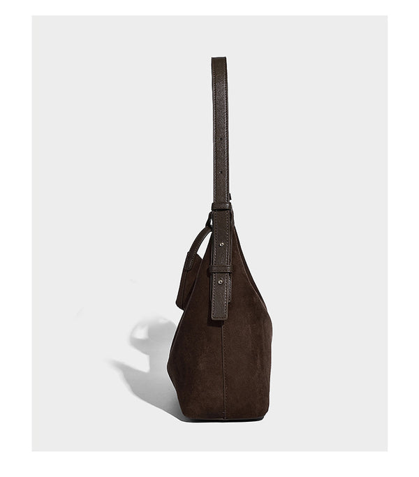 Dark brown suede-look hobo shoulder bag with top zip closure, adjustable strap, and small detachable mini pouch, detail view