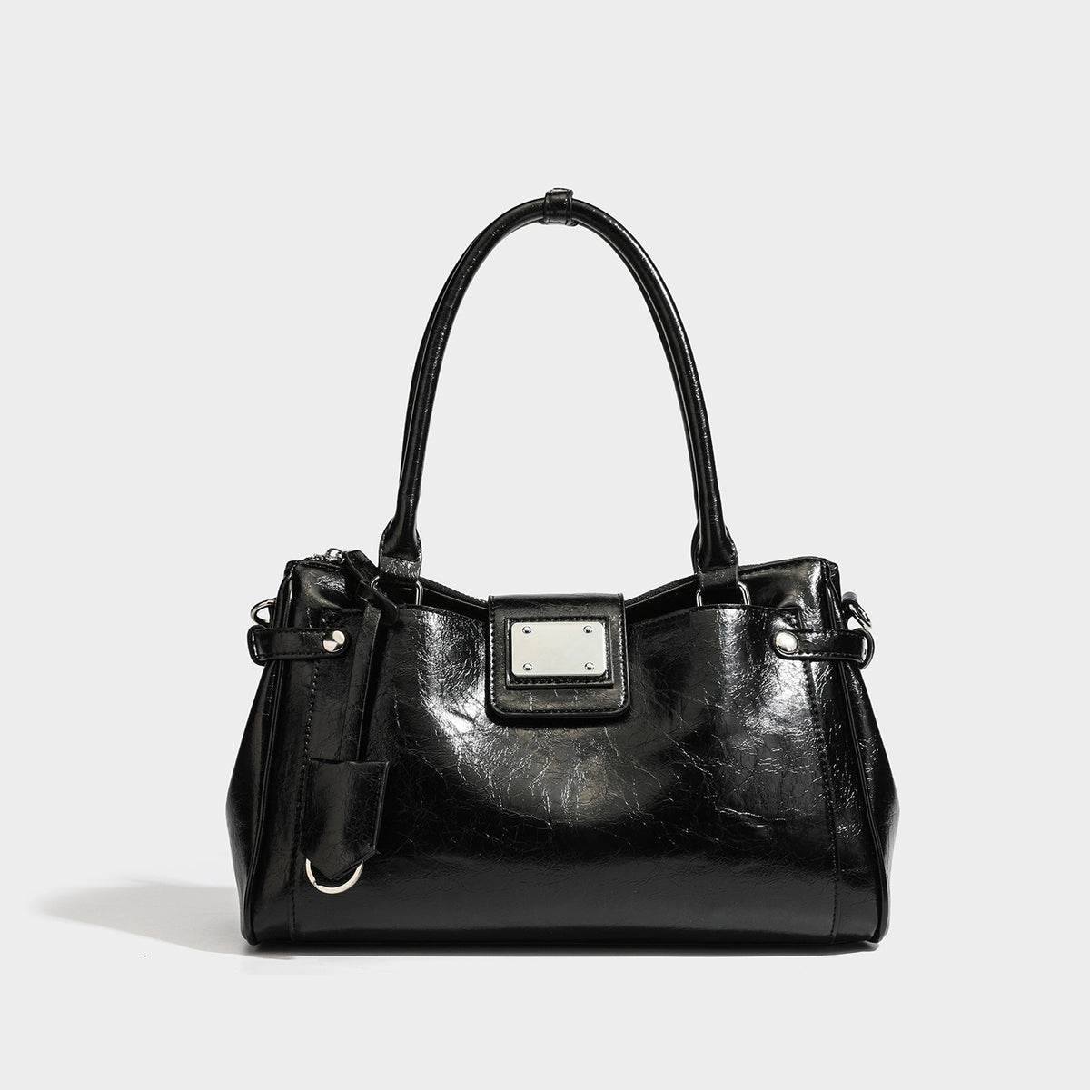 Structured glossy crinkled leather-look satchel with double top handles, front metal-plaque tab, silver-tone hardware, and