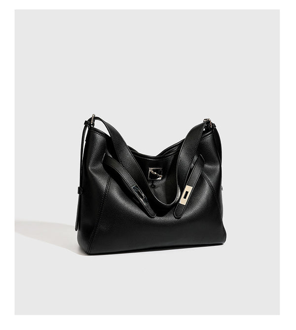 Large black pebbled leather-look hobo shoulder bag with silver-tone turn-lock front hardware and single flat adjustable