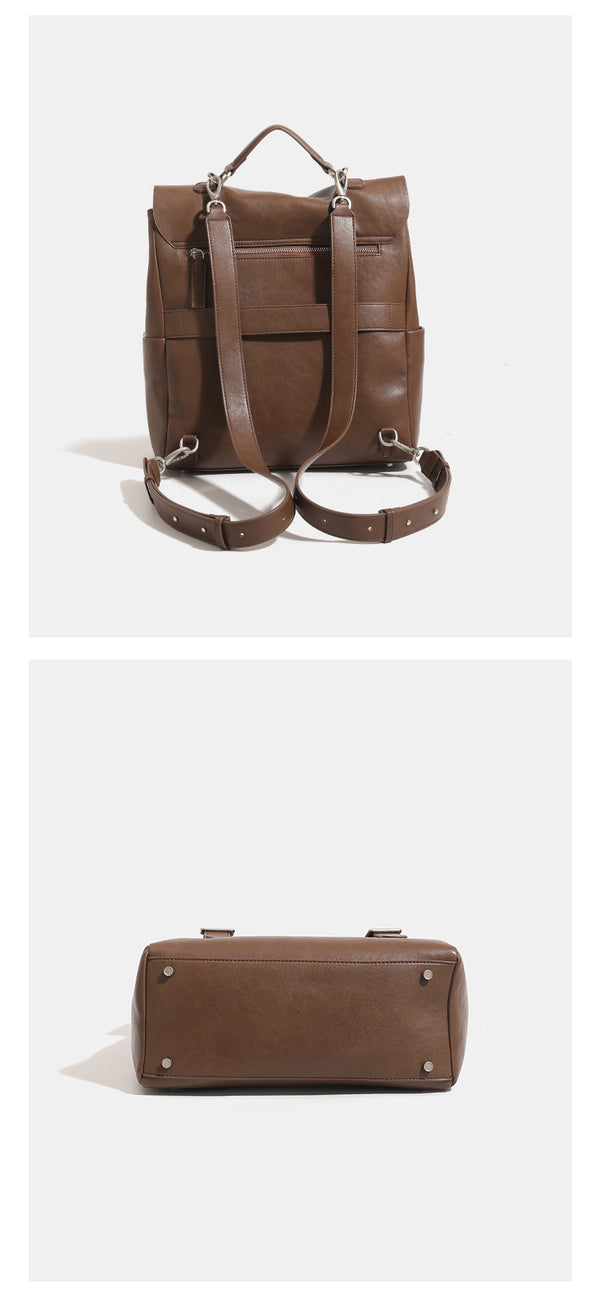 Structured flap backpack handbag in smooth leather-look finish with buckle front pocket, top handle, and silver-tone
