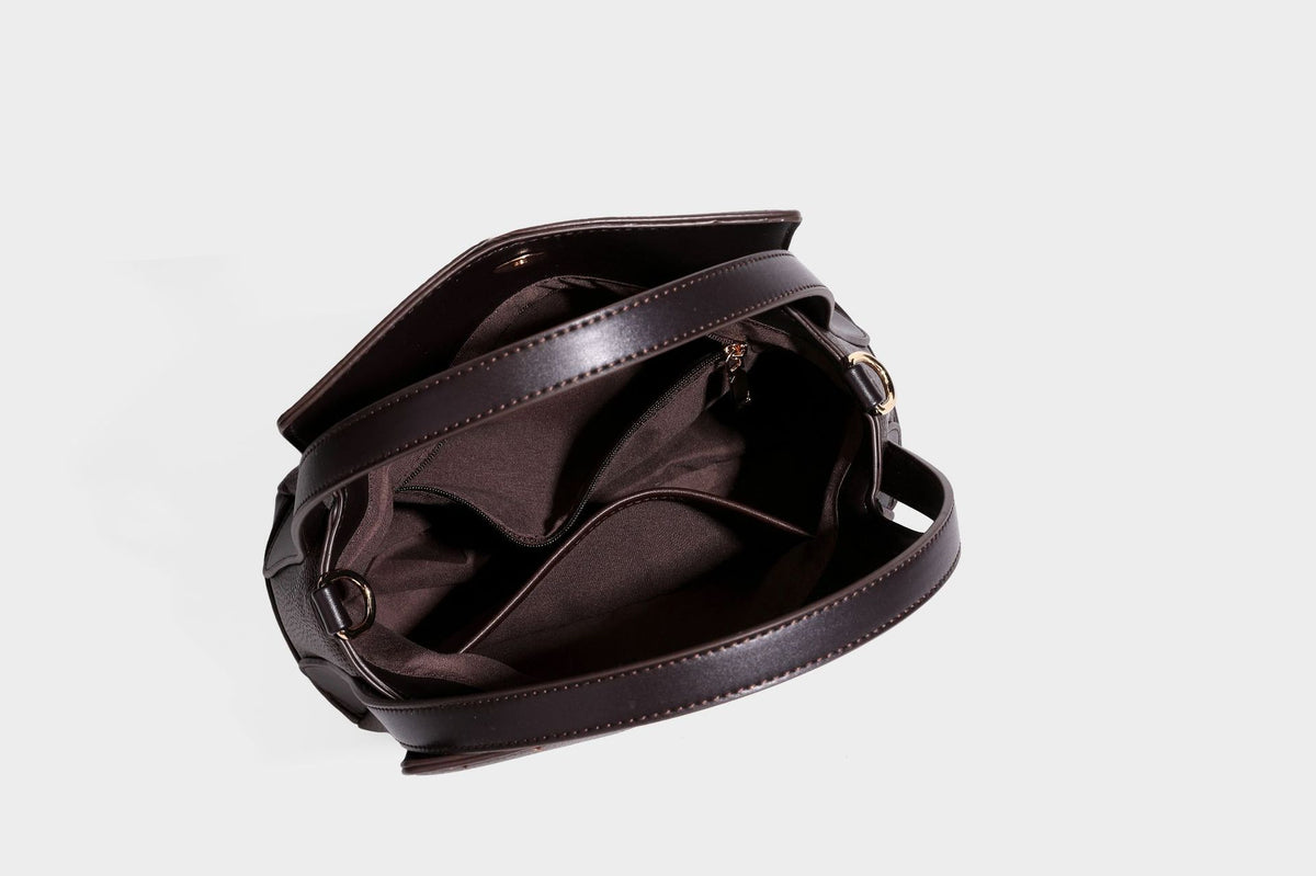 Structured pebbled leather-look shoulder bag with flap top, gold-tone emblem hardware, dual top handles, and detachable