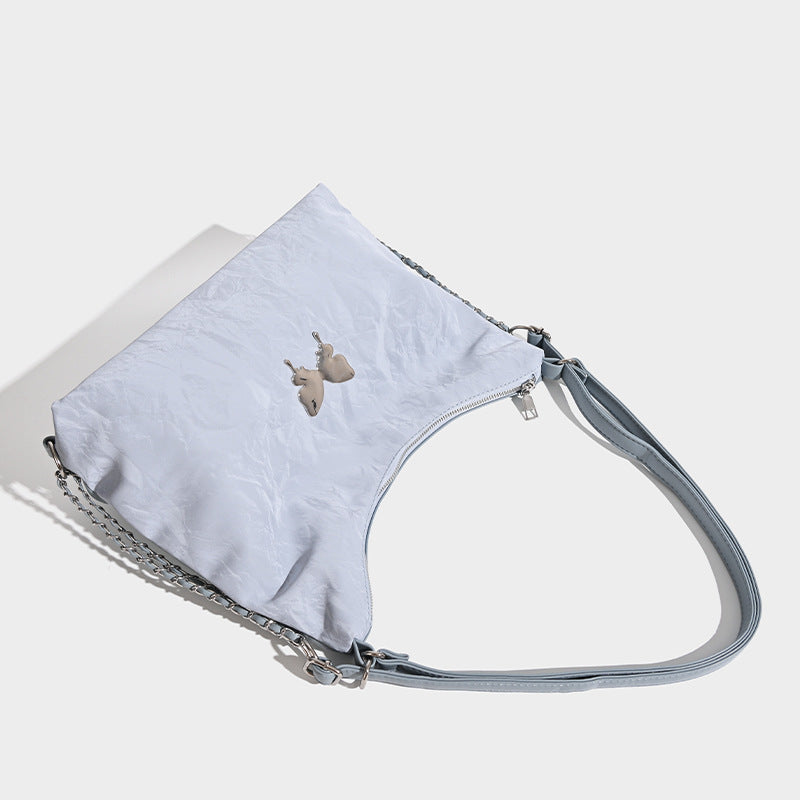 Crinkle-finish hobo shoulder bag with silver-tone chain side panels and butterfly embellishment, detail view 3