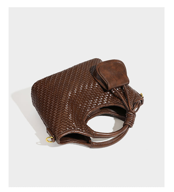 Woven leather-look tote bag in mocha brown with knotted top handle, front flap pocket, and detachable crossbody strap with