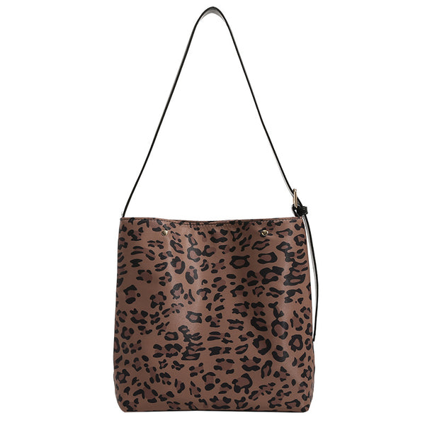 Brown and black leopard print canvas bucket bag with adjustable black leather-look shoulder strap and gold-tone hardware