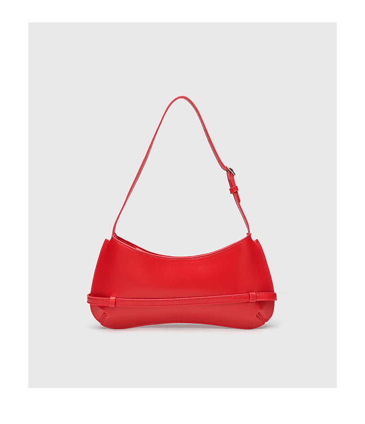 Curved baguette shoulder bag with front buckle strap and adjustable thin strap in glossy leather-look finish, detail view 12