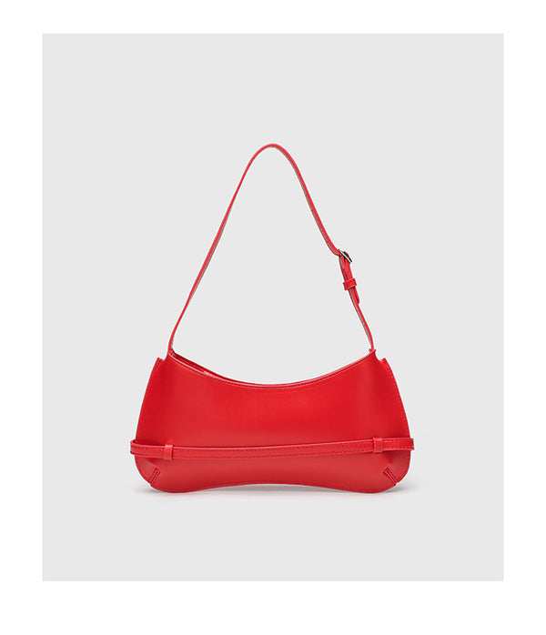Curved baguette shoulder bag with front buckle strap and adjustable thin strap in glossy leather-look finish, detail view 12